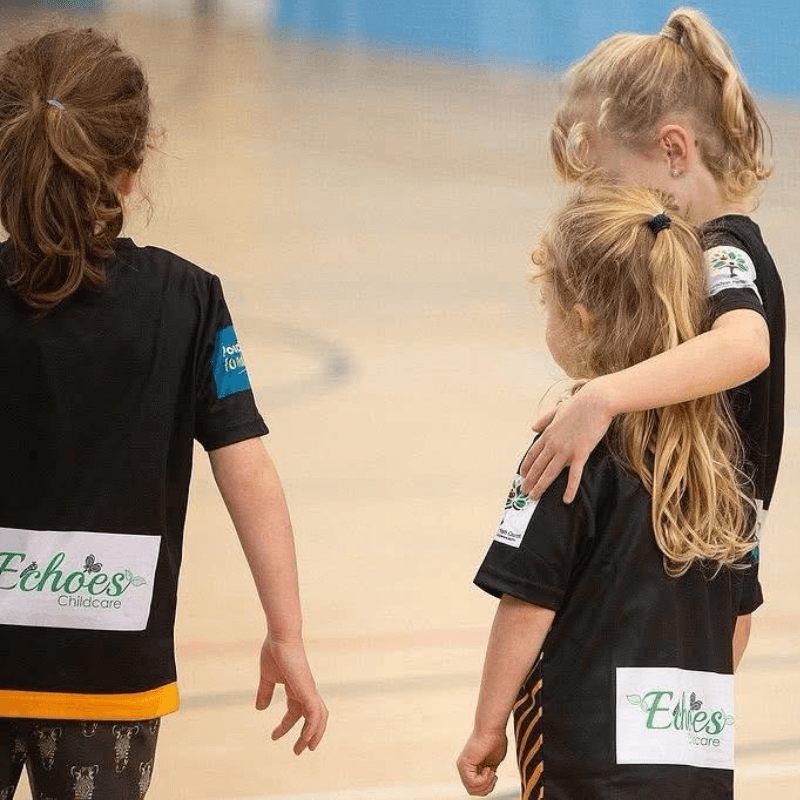 Net Ninjas juniors playing badminton at Broadclyst Sports Hall