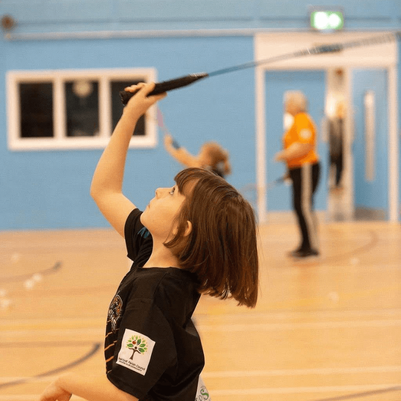 Net Ninjas juniors playing badminton at Broadclyst Sports Hall