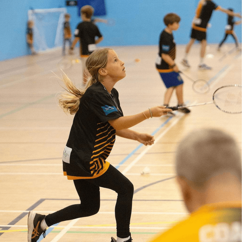 Net Ninjas juniors playing badminton at Broadclyst Sports Hall
