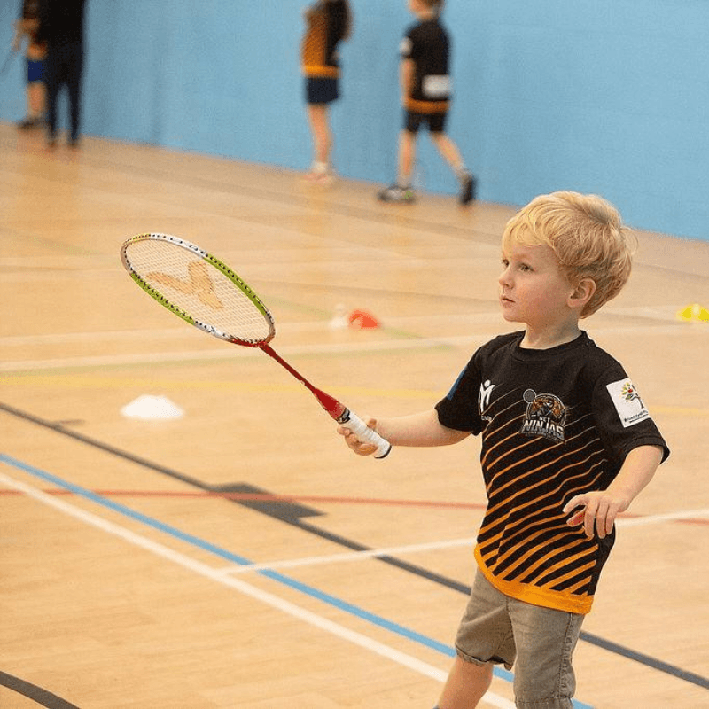Net Ninjas juniors playing badminton at Broadclyst Sports Hall
